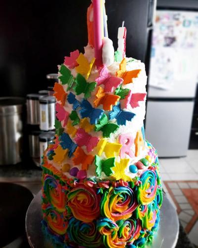 Butterflies on the side of a 2 tier Cake